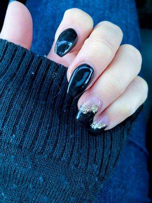 Black coffin nails with half gold foil, black, and clear dipped nails