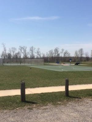 Basketball and tennis courts. Skateboard ramps