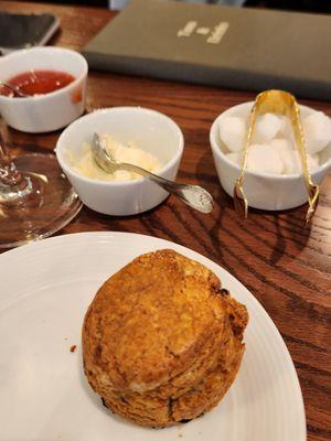 Currant scone with clotted cream and strawberry jam