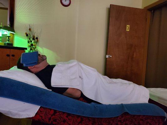 Lying on the table waiting for the foot soak portion of the massage.