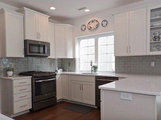 Beautiful white cabinetry w/ glass backsplash.   Commack, NY June 2021