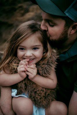 Daddy and daughter moment while snuggling by the Trophy Club, Tx creek.