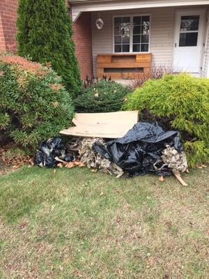 The "experts" at Preferred Relocation left a pile of trash in my front yard! And yes, that's my headboard which they left on my front porch!