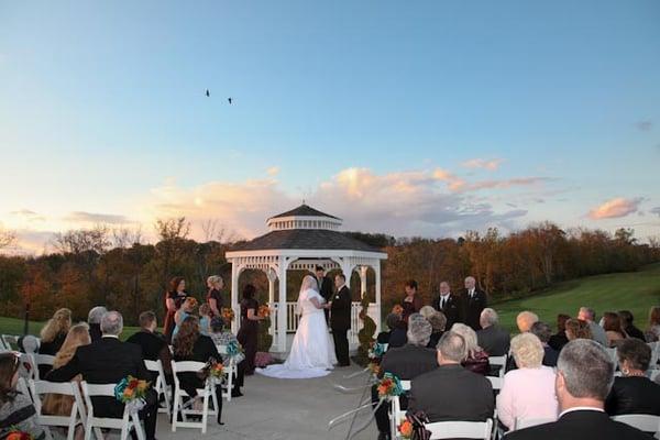 Stunning fall wedding at outdoor gazebo.