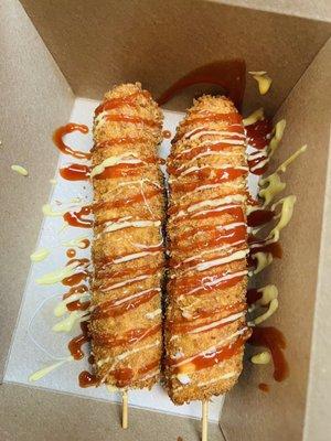 Korean cheese corn dogs with ketchup and yellow mustard