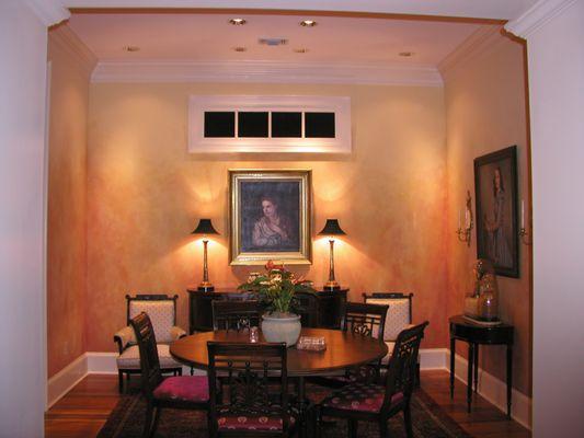 A warm dining room.    Paint by home owner, lighting by PEMBA.