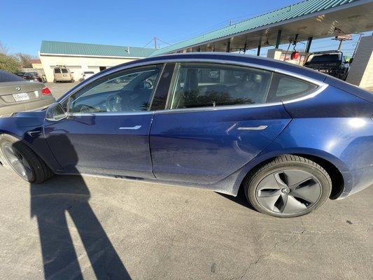 My filthy car waiting in line for the wash.