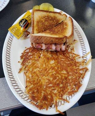 Texas bacon egg & cheese melt with hashbrowns.