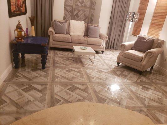 Brand new flooring extends up the wall for a modern design aesthetic