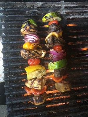 Marinated chicken and beef kebabs on the char broiler