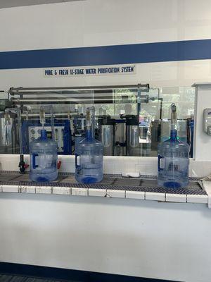 Filling water bottles for Barefoot and Free Yoga Festival, at Proud Lake Recreation Park.