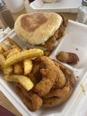 Fish Sandwich, fries, and onion rings