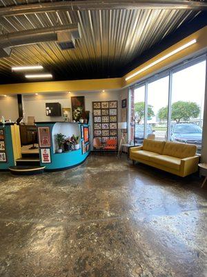 Clean, colorful, vibrant lobby! The colors match their storefront sign!