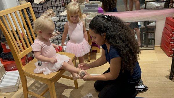 2-year old getting fitted for Tiny Twos dance class at St. Pete Dance Center