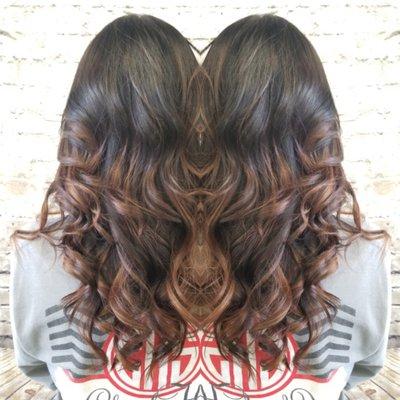 Dark brown rooty look with a caramel balayage