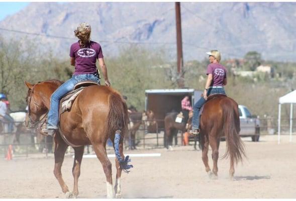 Sheryl's daughter on the left and Sheryl on the right. Warming up their horses at a local schooling show.