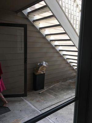 Tenants in unit #413 are leaving trash and trash can in front of their door every day