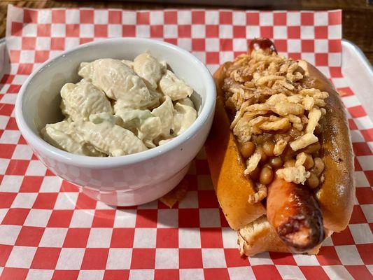 hot dog with delicious beans and crunchy fried onion topping. macaroni salad in the side.