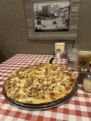 Sausage and mushrooms thin crust pizza.