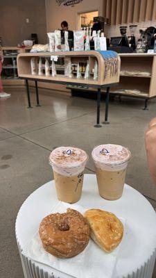 Coffees, glazed donut, and empanada.