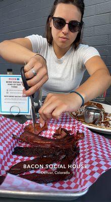 Here is my daughter carving up the bacon sampler. Wow! The Bloody Mary was also outstanding.