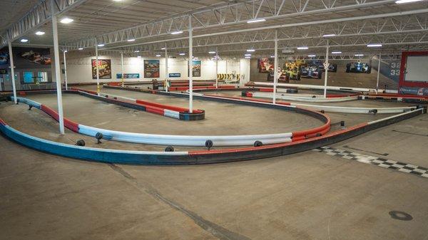 Another picture of K1 Speed Houston's indoor go kart track during the day.