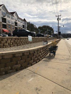 Two tiered rock retaining wall built by Herstad landscaping.