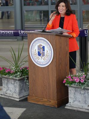 Governor of NY- Kathy Hochul speaks at grand opening SUNY Upstate - with Arrachme Art