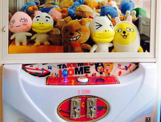 The Claw Toy Grabber Machine - insert 2 coins to play