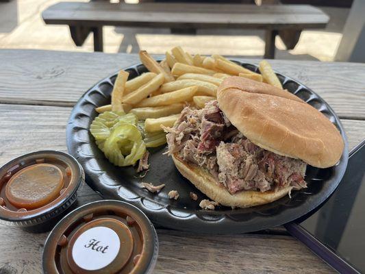 Pulled pork sandwich with side of fries