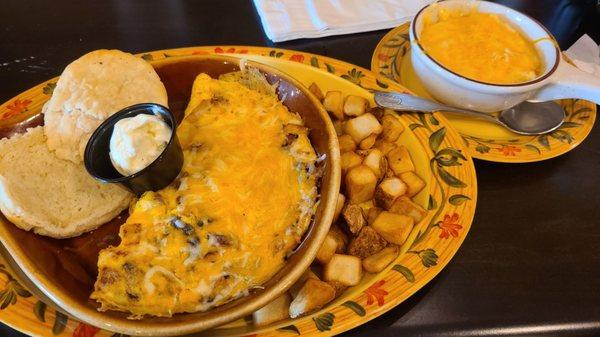 Dream omolette with chicken, sausage, and mushrooms with cheese grits.