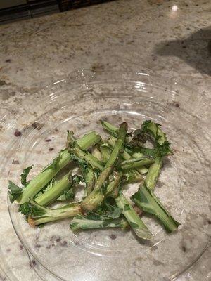 Inedible kale stems from one salad.