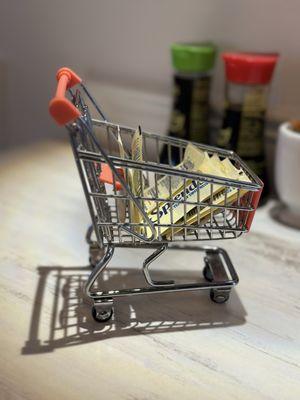 Shopping cart to hold sugar.