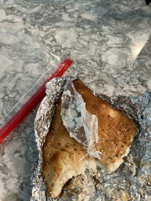 Calzone with nasty plastic that was baked in.