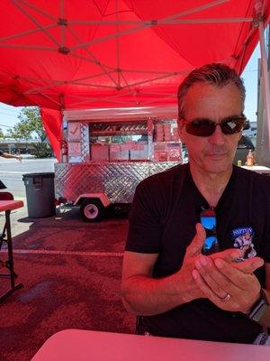 My husband getting ready to devour the Birria Tacos.