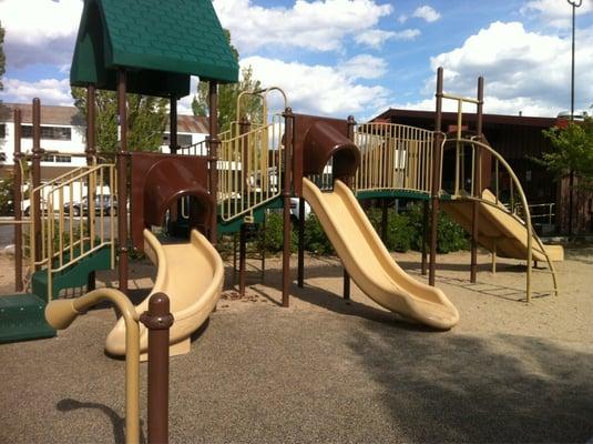 The playground equipment is small but perfect for little kids.