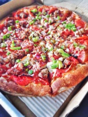 Pepperoni, sausage, onions, and green peppers! Sooooo good! Very fresh.