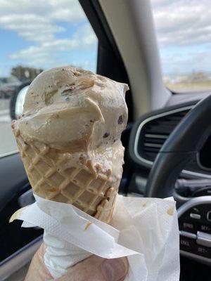 Half eaten waffle cone Caramell explosion. It is the best. The best ice cream in town to waffle cone