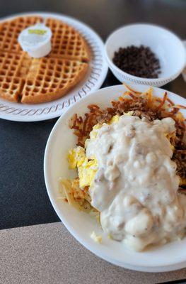 Sausage Egg and Cheese Hashbrown Bowl with gravy and a side waffle with chocolate chips