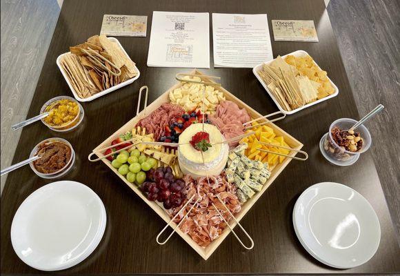 Charcuterie Board set up for my office with info about the stand.