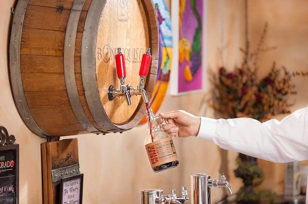 We feature wine on tap in 1 Liter refillable growlers.