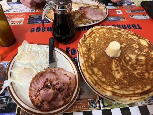 8. Sparky's Breakfast with Choice of Meat. This is the 8a, the smaller version, with eggs, ham, and blueberry pancake