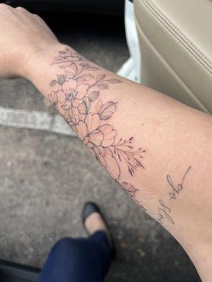 Too if floral tattoo and script