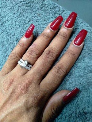 Acrylic gel polished coffin shaped nails.