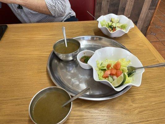 Two salads with complementary soup. There's also some sort of salsa which we used as a salad dressing.