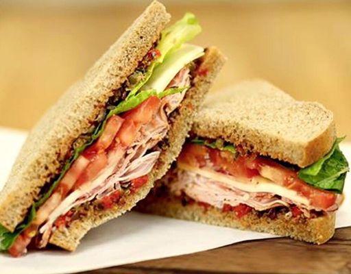 The Italian features a divine made from scratch olive tapenade and is stacked high with ham, salami and provolone on fresh bread.