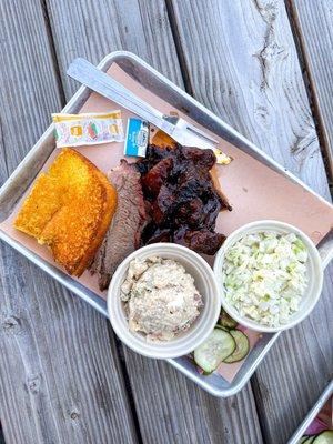 Two Meat Combo Plate with burnt ends, brisket, coleslaw, corn bread, and potato salad