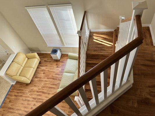 More stairway and living room area completed with flooring installed by Latta