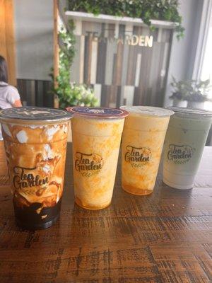 Milk tea with brown sugar boba, 2 mango smoothies, matcha green tea ice latte