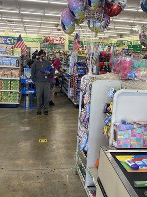 The long line to the back of the store. At that time, there was only one register open, smh.